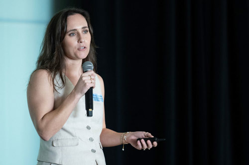 Presenter on stage with microphone