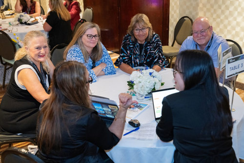 Meaningful connections. Small group of attendees at a round table