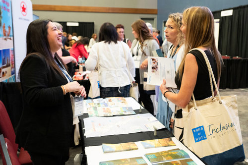 trade show supplier and attendees sharing a laugh